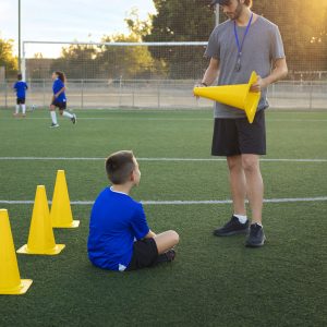 full shot football trainer teaching kids